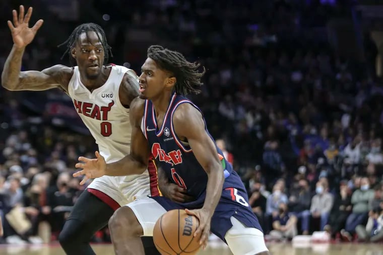 Sixers Tyrese Maxey drives on Heats Marcus Garrett during the 2nd quarter at the Wells Fargo Center in Philadelphia, Wednesday, December 15, 2021.