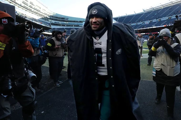 Eagles quarterback Jalen Hurts walks off the field after the team's 25-20 victory Sunday over the Bears at Soldier Field.