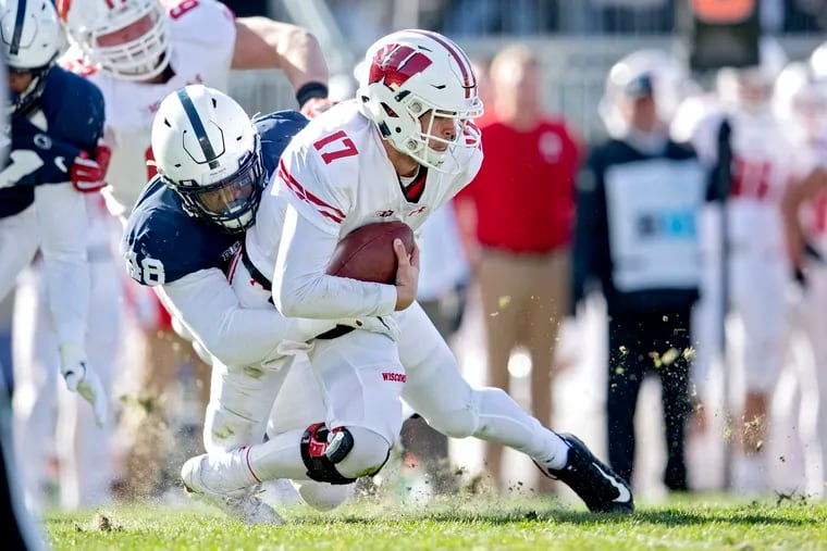 Penn State defensive end Shareef Miller, here sacking Wisconsin quarterback Jack Coan in a Nov. 10 game, said he has made up his mind on the NFL Draft but won't announce his decision until after the Citrus Bowl.