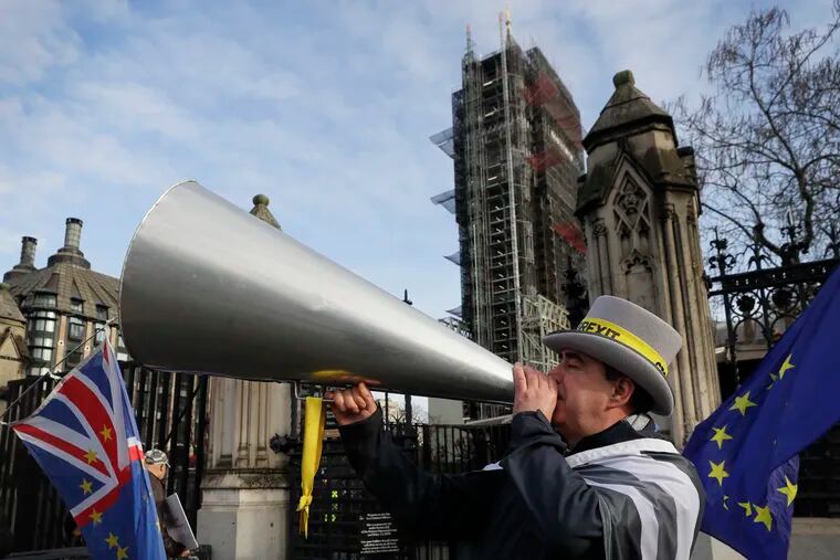 Anti Brexit campaigner Steve Bray demonstrates outside Parliament in London, Wednesday, Jan. 15, 2020. Britain is due to leave the European Union on Jan. 31.
