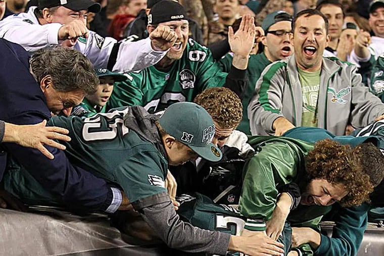 Eagles running back LeSean McCoy celebrates with fans. (Yong Kim/Staff Photographer)