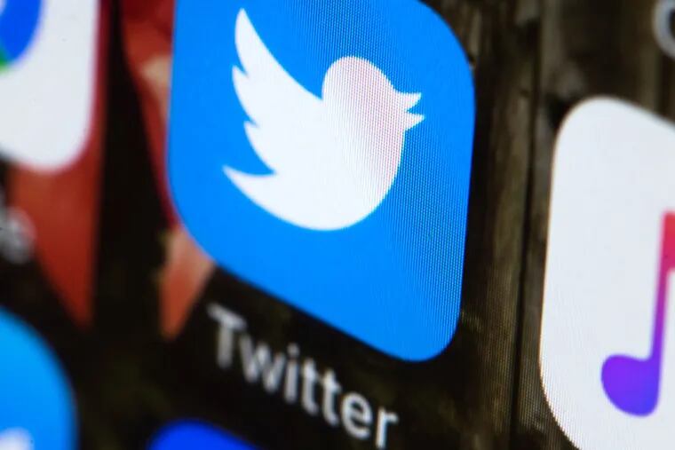 This April 26, 2017, file photo shows the Twitter app on a mobile phone in Philadelphia. Twitter is advising all users to change their passwords. The company said Thursday, May 3, 2018, that it recently discovered a bug that stored passwords in an internal log in an unprotected form.