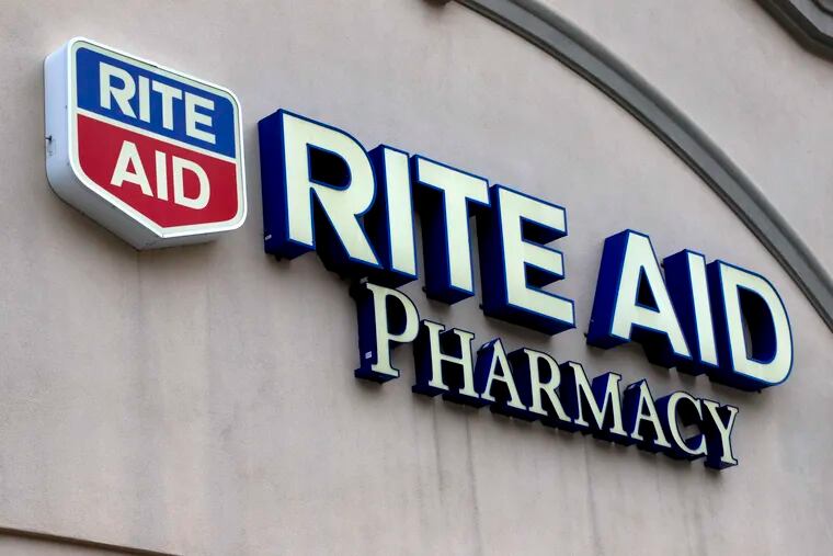 This April 14, 2020, file photo shows the sign on a Rite Aid Pharmacy in Pittsburgh.  (AP Photo/Gene J. Puskar, File)