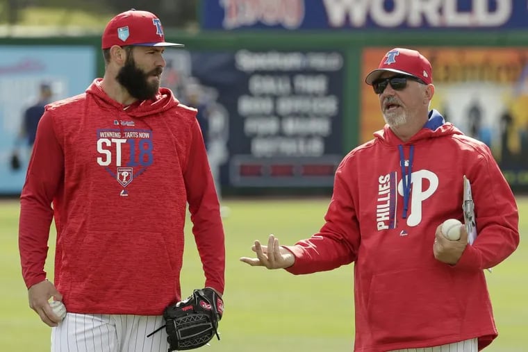 New Phillies pitcher Jake Arrieta, left, talks with pitching coach Rick Kranitz during a workout Tuesday in Clearwater.