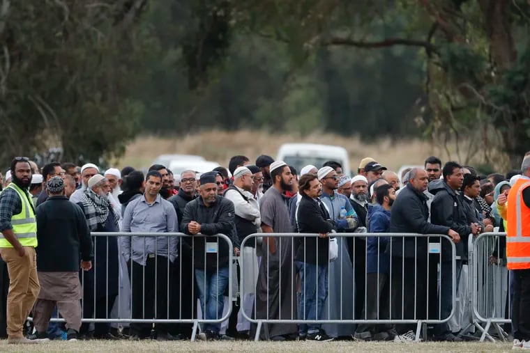 Mourners attend the service for a victim of the mosque shootings for a burial at the Memorial Park Cemetery in Christchurch, New Zealand, Friday, March 22, 2019.