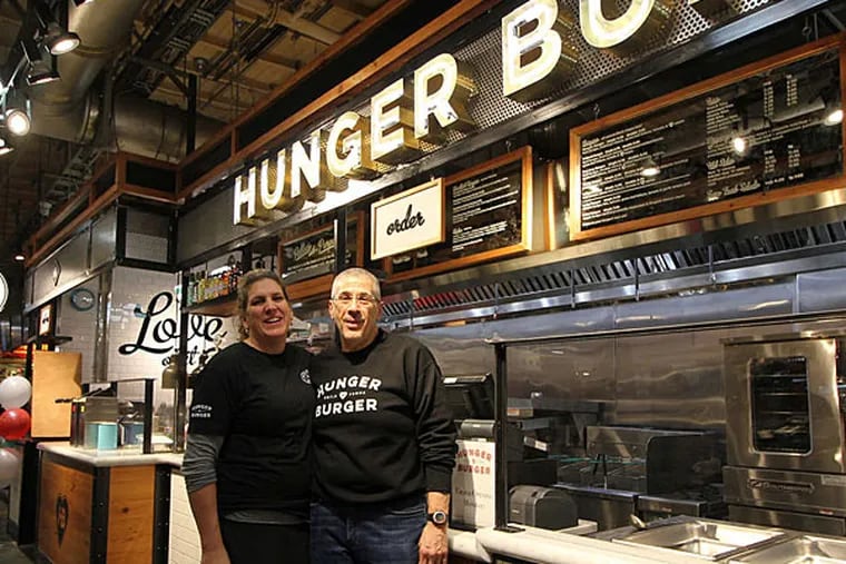 Kim and George Mickel at their new Reading Terminal Market stand. (MICHAEL KLEIN / Philly.com)