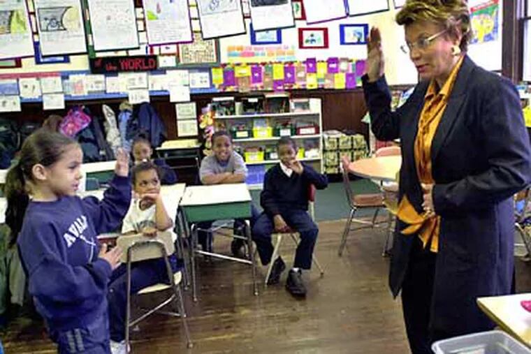 Dorothy June Brown with a pupil at Laboratory Charter School in 2002. (April Saul / Staff Photographer)