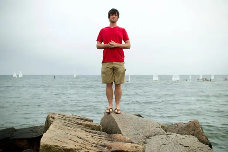 Andrew Forsthoefel poses for a photo on Old Silver Beach, North Falmouth, Mass., on July 11, 2013. In October of 2011, Forsthoefel set out from Chadds Ford, Pennsylvania and walked over 4000 miles to Half Moon Bay, California, and recorded interviews with people he met along the way.  He is currently living in Woods Hole, Massachusetts and working on a book about his experiences. (Matthew Healey / For The Philadelphia Inquirer)