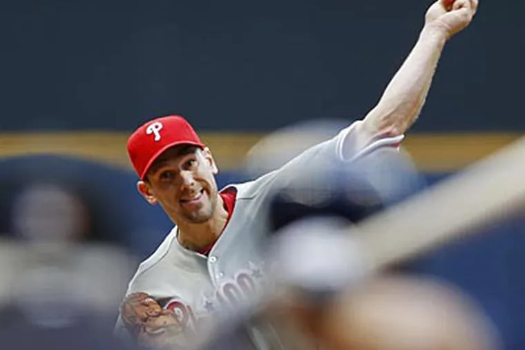 Cliff Lee pitched 7 2/3 innings, allowed three earned runs and struck out 12 against the Brewers. (Tom Lynn/AP)
