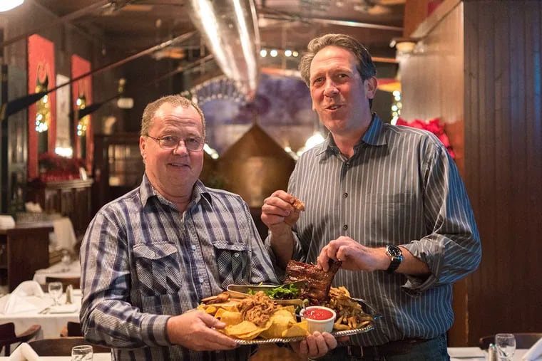 Founder Jack McDavid (left) and owner Mick Houston at Jack's Firehouse in Fairmount.