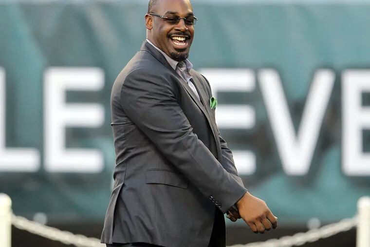 Formers Eagles' quarterback Donovan McNabb smiles while meeting with media members before the Eagles play the Kansas City Chief on Thursday, September 19, 2013.  ( Yong Kim / Staff Photographer )