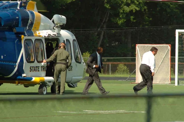 Gov. Christie (right) arrives by helicopter at his son's ball game in Montvale, N.J. After five innings, play was halted as he left for a Drumthwacket dinner. Christie and the GOP later agreed to pay for the service.