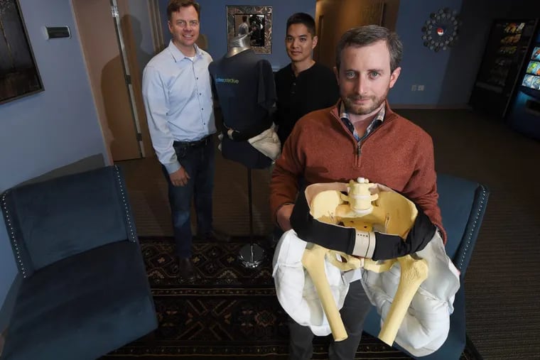 From left, Drew Lakatos, CEO, Wamis Singhatat, vice president of product development, and Zane McKinney, product specialist, with ActiveProtective’s patented airbag belt, designed to prevent fall-induced hip fractures.