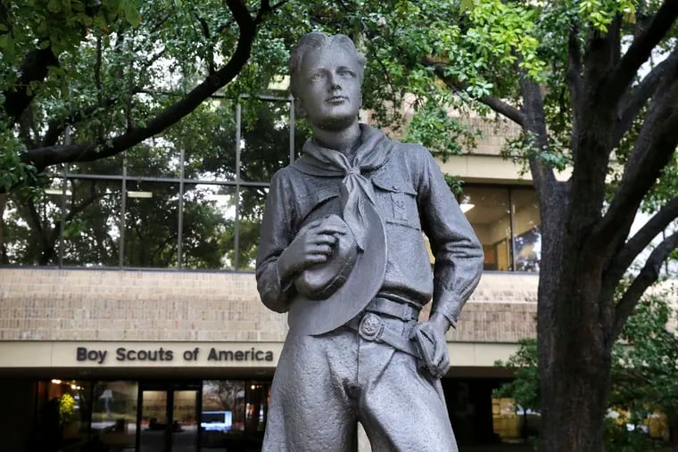 A statue stands outside the Boy Scouts of America headquarters in Irving, Texas. In an agreement announced Monday, Dec. 13, 2021, attorneys in the Boy Scouts of America bankruptcy have reached a tentative settlement under which one of the organization's largest insurers would contribute $800 million into a fund for victims of child sexual abuse.