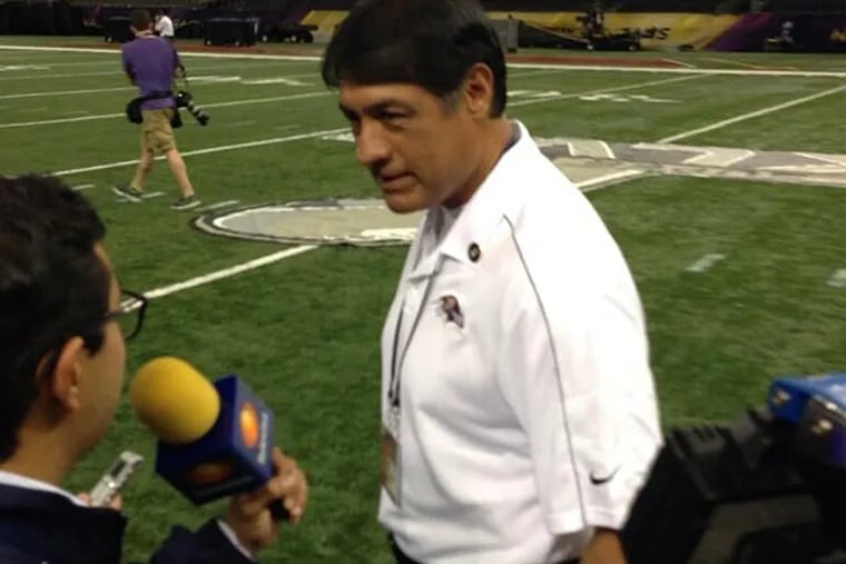 Juan Castillo answers questions at Super Bowl media day. (Jeff McLane/Staff)