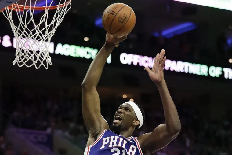 Joel Embiid and the rim — made for each other. YONG KIM / Staff Photographer