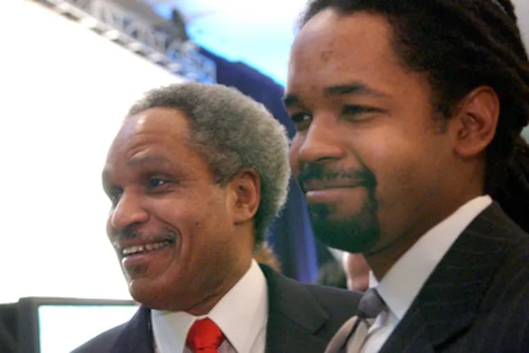 Sharif Street (right) with his father, John F. Street, former mayor and former chairman of the Philadelphia Housing Authority board. (Jessica Griffin / File Photo)
