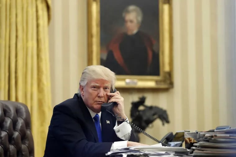 In this Jan. 28, 2017 file photo, President Trump speaks on the phone with Australian Prime Minister Malcolm Turnbull in the Oval Office of the White House, in front of a portrait of former president Andrew Jackson.