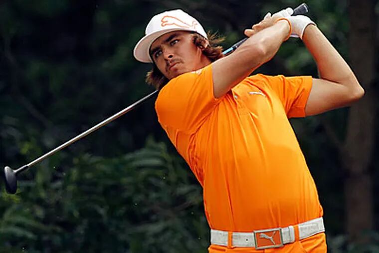 Rickie Fowler hit a wedge into 4 feet to birdie the 18th hole and win the Wells Fargo Championship. (Chuck Burton/AP)