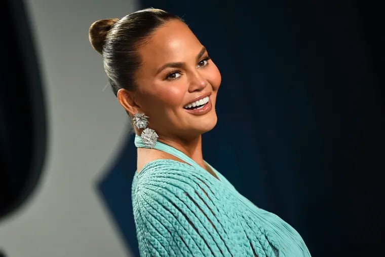 Chrissy Teigen arrives at the Vanity Fair Oscar Party in Beverly Hills, Calif. Teigen has publicly commented on undergoing buccal fat removal — a cosmetic procedure that has been trending on TikTok over the last month.