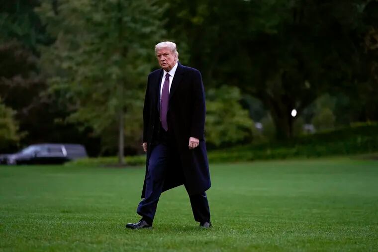 President Donald Trump walking from Marine One to the White House on Friday.