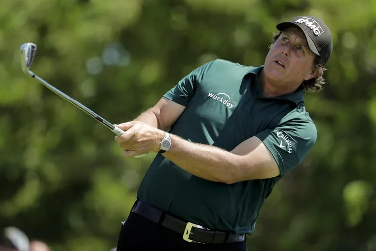 Phil Mickelson plays a shot on the 11th tee during the third round of the U.S. Open Golf Championship on Saturday.