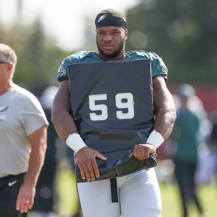 Eagles guard Tyler Steen during training camp practice next to coach Jeff Stoutland at the NovaCare Complex on Aug. 19.