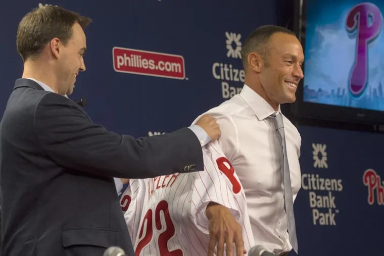 Phillies general manager Matt Klentak (left) believes Gabe Kapler (right) will slip comfortably into his role as the team’s new manager. (TOM GRALISH/Staff photographer)