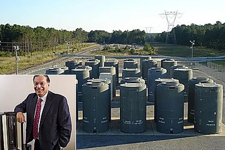 The Joseph M. Farley Nuclear Plant, near Dothan, Ala.,with casks made by Holtec of Marlton, N.J., for "dry storage" of nuclear waste. Kris Singh (inset), Holtec's CEO, with metal canisters for nuclear-waste storage. (Clem Murray / Staff Photographer; casks photo courtesy of Holtec)