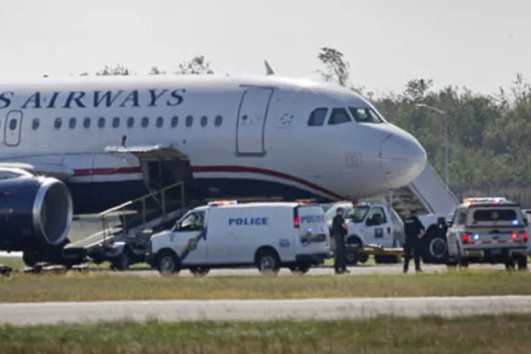 Philadelphia police investigate suspicious activity on a USAirways plane at Philadelphia international airport on Thursday, October 7, 2010. (Alejandro A. Alvarez / Staff Writer)