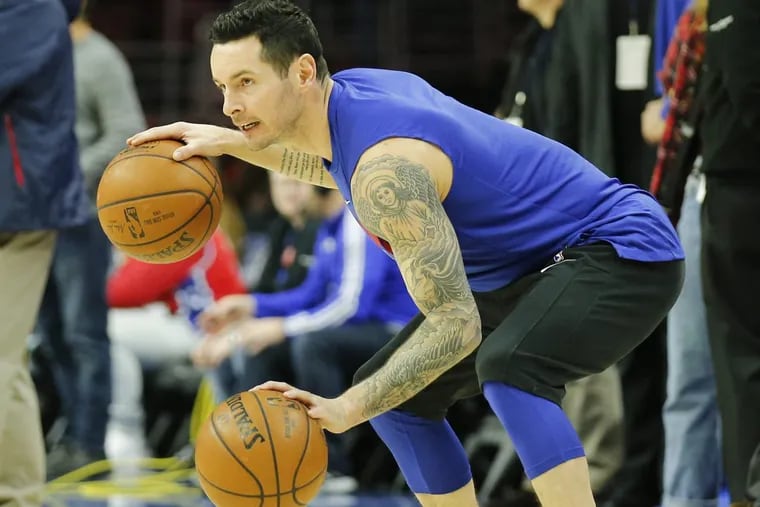 Sixers guard JJ Redick dribbles two basketballs during warm-ups prior to the game against the Detroit Piston on Friday, January 5, 2018 in Philadelphia.