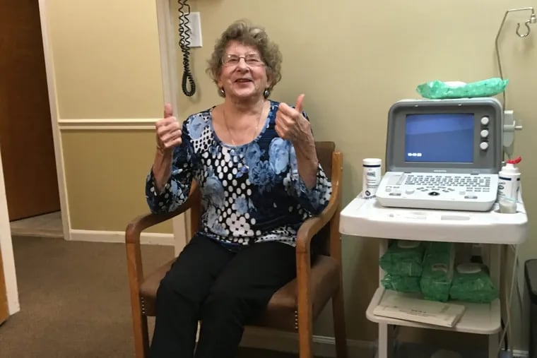 Milli Burke, 84, gives thumbs-up before a stem cell procedure she hopes will help her arthritic knees.