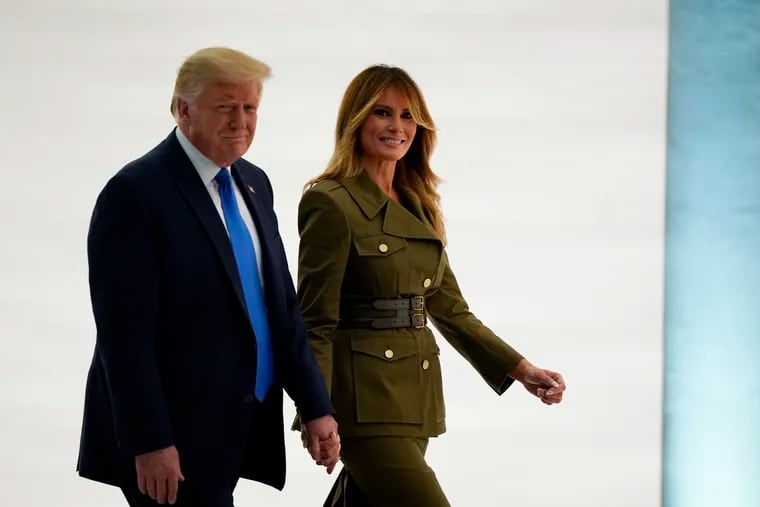 President Donald Trump leaves with First Lady Melania Trump after her speech to the Republican National Convention from the Rose Garden of the White House on Tuesday.