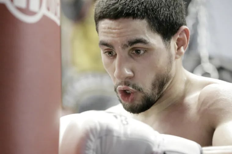 Danny Garcia hits the heavy bag during his workout before the media. (Elizabeth Robertson / Staff Photographer)
