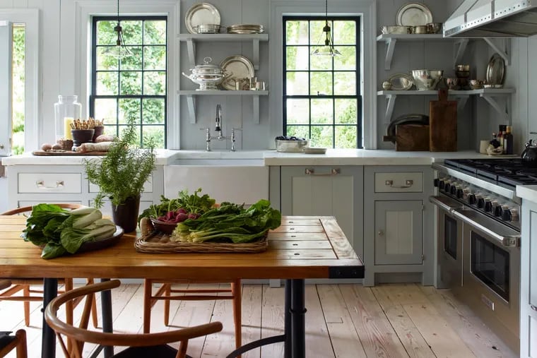 "A table has a domestic warmth to it that an island doesn't," Steven Gambrel says.
