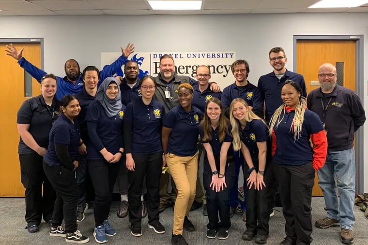 Students receive their EMT course completion certificates from Drexel University in Fall 2019.