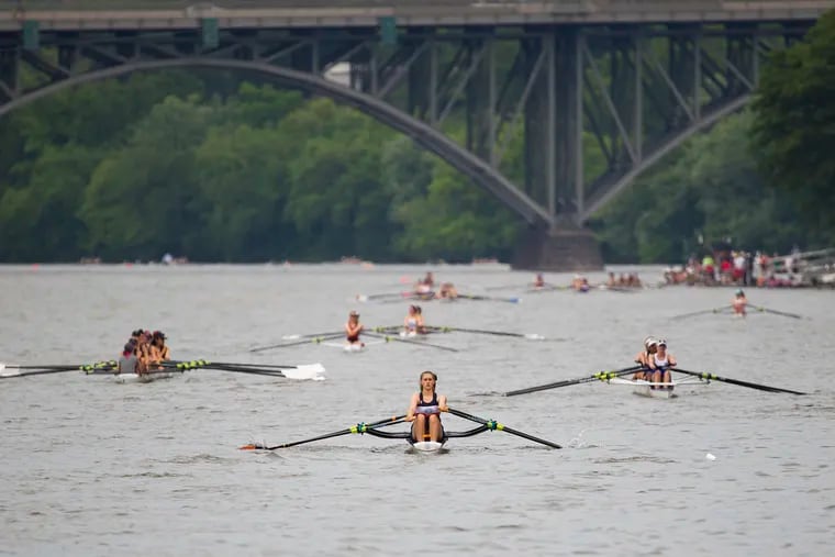 Rowers make their way up the Schuylkill River to compete on the first day of the Stotesbury Cup Regatta in Philadelphia on Friday, May 17, 2019.