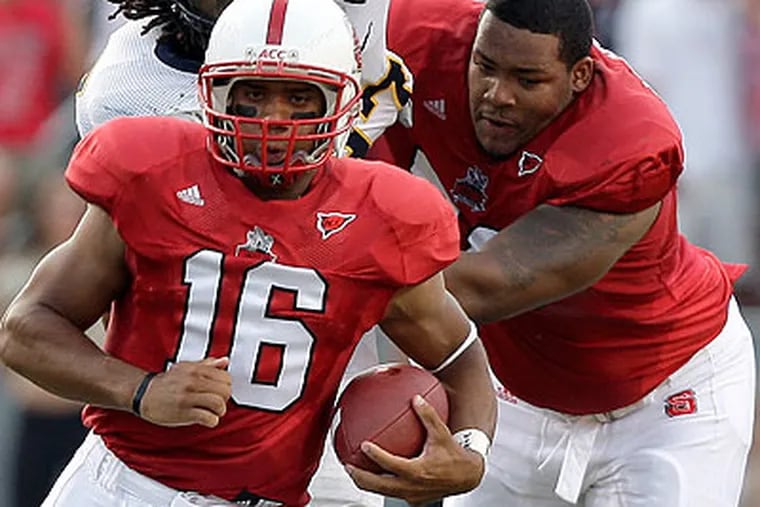North Carolina State's Jeraill McCuller (right) was among the Eagles' undrafted rookie signings. (Michael Conroy/AP)