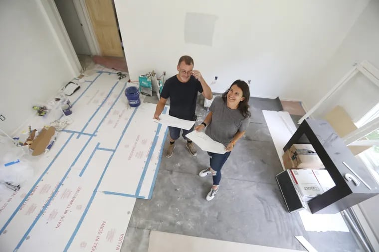 With general contractor Stephen Jenkins, Lauren Lipowicz, 38, has found herself to be the real estate agent who gets millennials into houses on the Main Line, here at 1220 Gladwyne Drive, Gladwyn, Pa., Aug. 9, 2018. DAVID SWANSON / Staff Photographer .