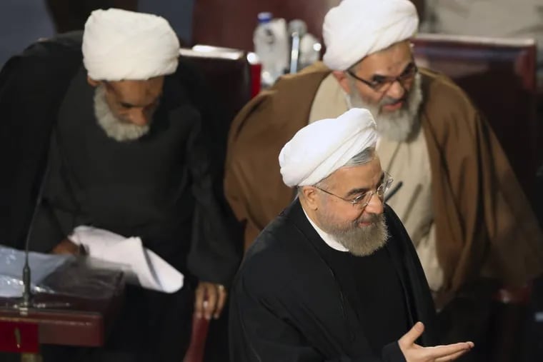 Iranian President Hassan Rouhani, who is also a member of the Assembly of Experts, arrives to attend a biannual meeting of the assembly in Tehran, Iran, Tuesday, March 10, 2015. Iran's most influential clerical body charged with choosing or dismissing the nation's supreme leader has elected a hard-line ayatollah as its new chairman, the official IRNA news agency reported on Tuesday. IRNA said Mohammad Yazdi, the deputy chairman of the 86-member Assembly of Experts, got 47 votes in his favor from among 73 clerics who attended the session. (AP Photo/Vahid Salemi)