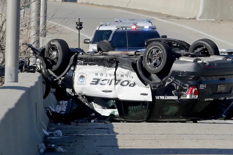 A Wilmington Delaware police vehicle flipped in a chase along northbound I-95 near Philadelphia International Airport in Philadelphia, PA on January 9, 2019. The suspect later crashed his vehicle at Broad and Oregon but was able to get away on foot,according to police.