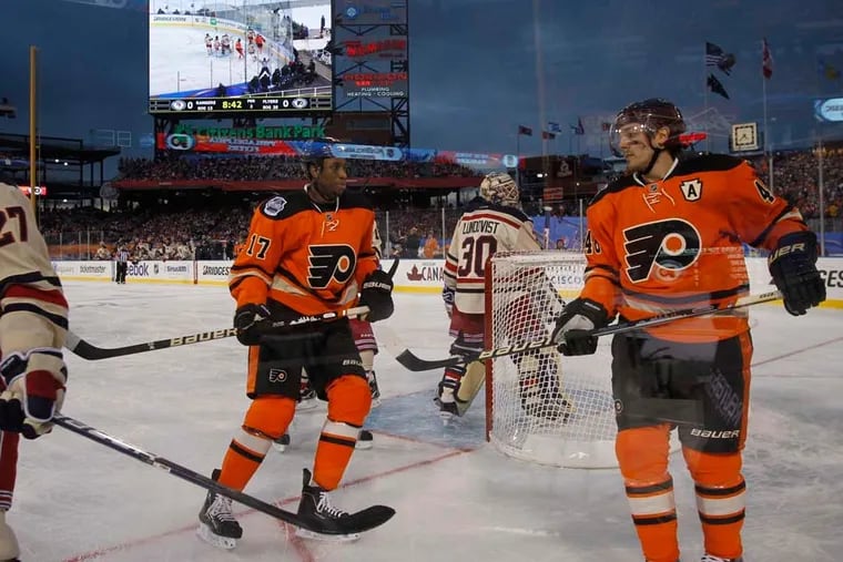 The Flyers' Wayne Simmonds (17) and Danny Briere skating around the net during the 2012 Winter Classic against the Rangers at Citizens Bank Park. Simmonds, who is on the trade block, could be playing his final game as a Flyer on Saturday at Lincoln Financial Field.