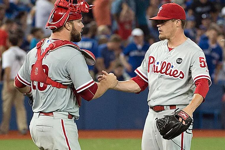 Philadelphia Phillies catcher Cameron Rupp (29) and Philadelphia Phillies relief pitcher Ken Giles (53) celebrate their win after a game against the Toronto Blue Jays at Rogers Centre. The Philadelphia Phillies won 3-2. (Nick Turchiaro/USA Today)