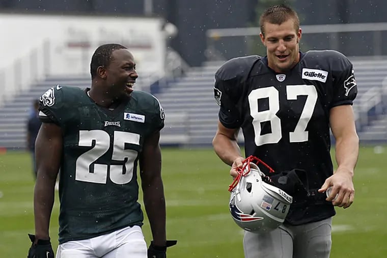 Eagles running back LeSean McCoy and Patriots tight end Rob Gronkowski. (Yong Kim/Staff Photographer)