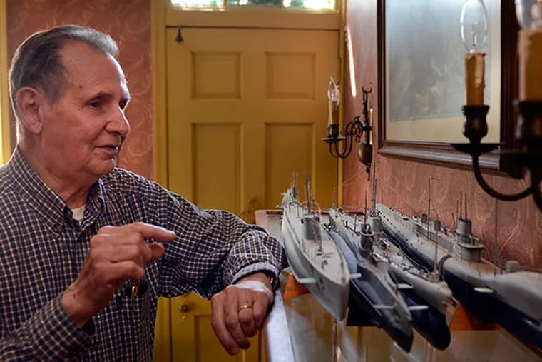 Edwin Leaf with some model submarines in his Edgewater Park home April 17, 2014. The octogenarian's work will be on display at Philadelphia International Airport. ( TOM GRALISH / Staff Photographer )