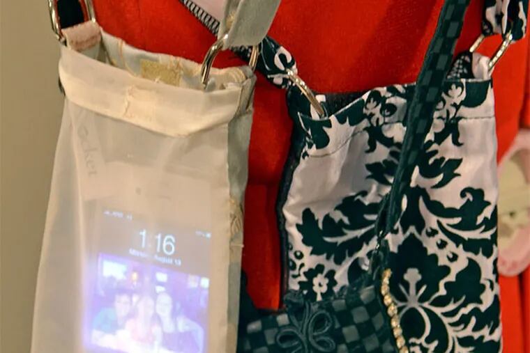 Beth Tucker's Eye-Pocket, a handy way for women to carry their cellphones free from the crowded confines of a purse. (Tom Gralish / Staff Photographer)