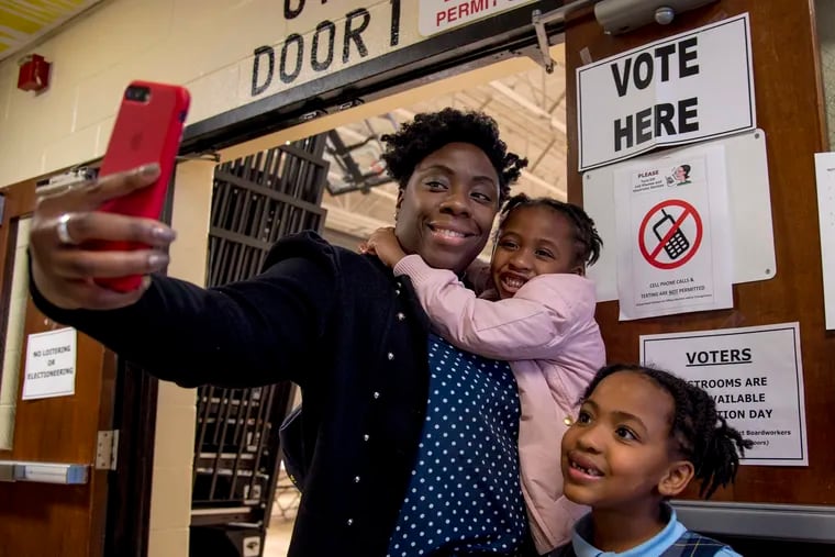 Nirvana Nobrun of Burlington Township poses for a selfie with her daughters Rylee, 7, and Reese, 4 after voting in the Burlington High School gym in November.