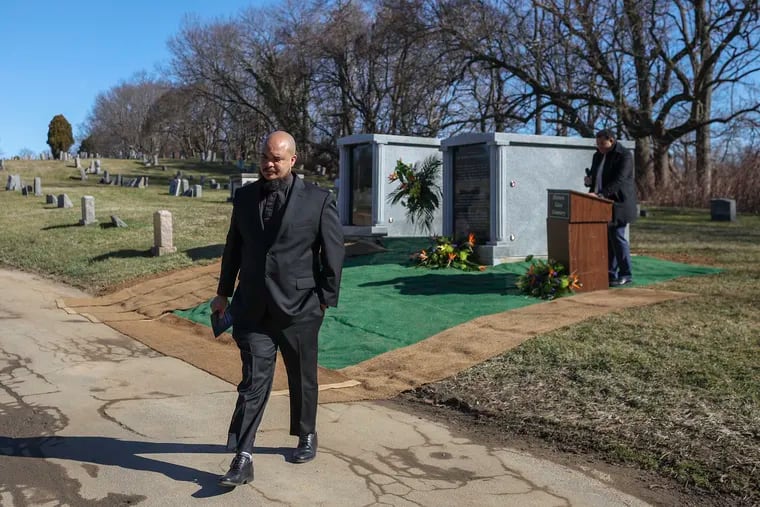 Rev. Charles Lattimore Howard walks away from the podium after speaking at a blessing ceremony for the 19 Black Philadelphians whose remains were stolen in the 1830s by a racist scientist and studied for centuries, whose bones have now been reburied by Penn at the Historic Eden Cemetery in Collingdale, Pa. on Saturday, Feb. 3, 2024.