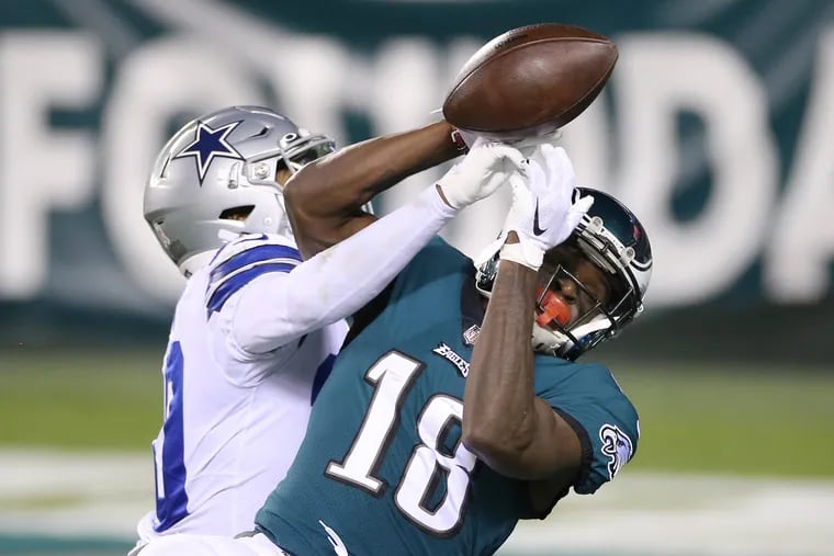 Eagles rookie wide receiver Jalen Reagor can't hang on to a pass against the Cowboys earlier this month as cornerback Anthony Brown knocks it away.