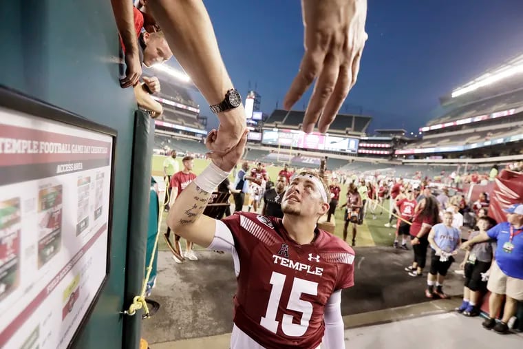 Temple quarterback Anthony Russo high fives fans after winning the Georgia Tech vs Temple University football game at Lincoln Financial Field in Phila., Pa. on September 28, 2019.